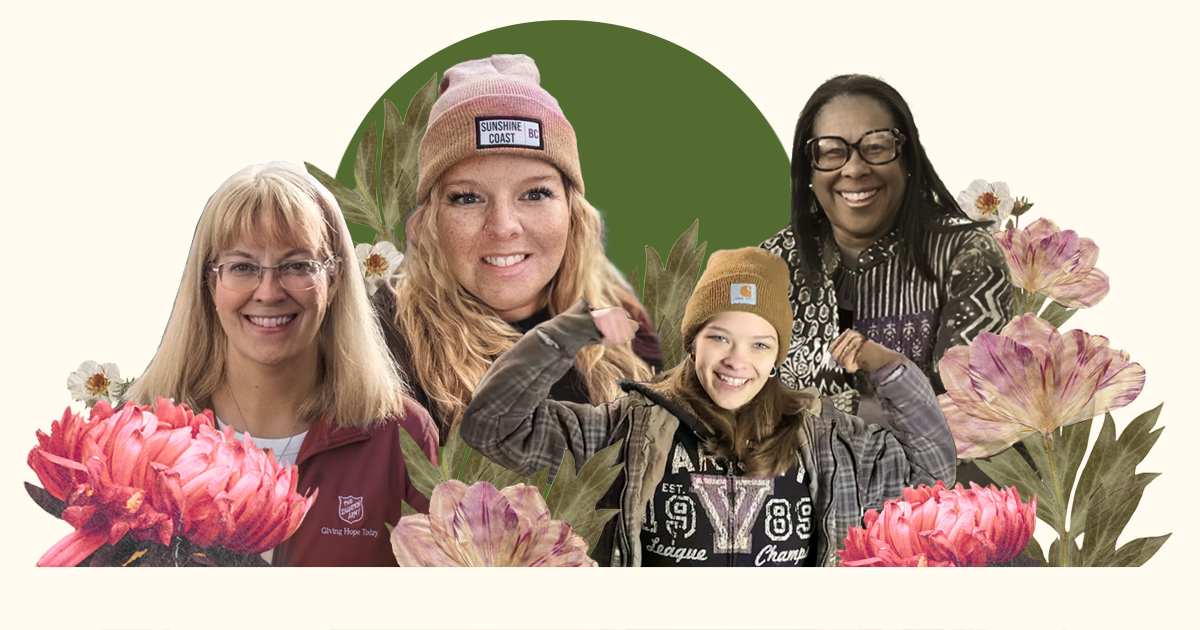 Four women with flowers in the background